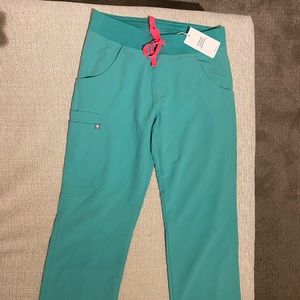 Figs scrubs- surgical green. size xs. Never worn before, tags still on item.